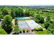 Aerial view showcasing community pool, tennis court and basketball court amidst serene tree-lined surroundings at 10397 Yates Ct, Westminster, CO 80031