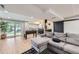 Inviting basement with a large sectional sofa, foosball table and a sliding glass door to the yard at 10397 Yates Ct, Westminster, CO 80031