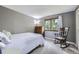 Cozy bedroom with a rocking chair, hardwood dresser, and plush carpeting at 10397 Yates Ct, Westminster, CO 80031