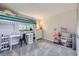 Bright bedroom featuring a loft bed with a study area beneath and playful decor at 10397 Yates Ct, Westminster, CO 80031