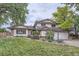 Charming home featuring a well-manicured lawn and a two-car garage with beautiful landscaping at 10397 Yates Ct, Westminster, CO 80031
