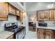 Cozy kitchen with stainless steel appliances and classic wooden cabinets at 10397 Yates Ct, Westminster, CO 80031