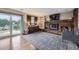 Inviting living room features a brick fireplace, sliding glass doors and a stylish area rug at 10397 Yates Ct, Westminster, CO 80031