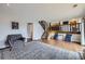 Open-concept living room with hardwood floors, a staircase, and cozy seating area at 10397 Yates Ct, Westminster, CO 80031