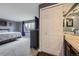 Spacious primary bedroom with ensuite bathroom and closet with mirrored doors at 10397 Yates Ct, Westminster, CO 80031
