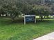 Sign for Hampshire Park, a Westminster park surrounded by green trees at 10397 Yates Ct, Westminster, CO 80031