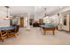 Finished basement with a pool table, ping pong table, and a cozy seating area at 22554 Treetop Ln, Golden, CO 80401