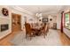 Formal dining room with a large table, decorative chairs, and elegant chandelier at 22554 Treetop Ln, Golden, CO 80401