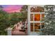 Enjoy the views from this spacious deck with patio seating and a gas grill, perfect for entertaining at 22554 Treetop Ln, Golden, CO 80401