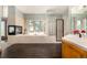 Bright main bathroom featuring a fireplace, soaking tub, and glass block shower at 22554 Treetop Ln, Golden, CO 80401