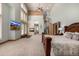 Expansive main bedroom with fireplace, TV, spiral staircase, and sitting area at 22554 Treetop Ln, Golden, CO 80401