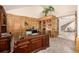 Spacious office with custom wood paneling, built-in bookshelves, and elegant desk at 22554 Treetop Ln, Golden, CO 80401
