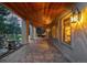 Stone patio with tongue and groove ceiling, perfect for outdoor entertaining with rock waterfall feature at 22554 Treetop Ln, Golden, CO 80401