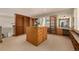 Large walk-in closet with custom storage and a vanity area with natural light at 22554 Treetop Ln, Golden, CO 80401