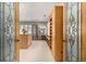 Well-organized walk-in closet with custom shelving and decorative glass doors at 22554 Treetop Ln, Golden, CO 80401
