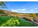 Scenic backyard overlooking rolling hills and distant homes at 15 Amaranth Dr, Littleton, CO 80127