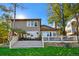 Expansive backyard deck offers ample space for outdoor entertaining and relaxation, steps to a green yard at 15 Amaranth Dr, Littleton, CO 80127