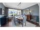 Formal dining room with modern lighting, hardwood floors, and neutral gray walls at 15 Amaranth Dr, Littleton, CO 80127