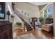 Elegant foyer with high ceilings and decorative staircase leading to an open living area at 15 Amaranth Dr, Littleton, CO 80127