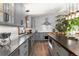 Modern kitchen with gray cabinetry, stainless appliances, and eat-in bar at 400 Upper Forest Rd, Idaho Springs, CO 80452