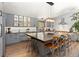 Modern kitchen with gray cabinetry, stainless appliances, large island and pendant lighting at 400 Upper Forest Rd, Idaho Springs, CO 80452
