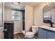 Modern bathroom with a stylish vanity, walk-in shower, and convenient laundry area at 7153 S Cody Cir, Littleton, CO 80128