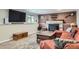 Cozy living room featuring a fireplace, comfortable seating, and a warm, inviting atmosphere at 7153 S Cody Cir, Littleton, CO 80128