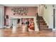 Open living space showcasing the staircase to the lower level and an inviting Gathering area at 7153 S Cody Cir, Littleton, CO 80128