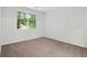 Cozy bedroom with neutral carpet and a large window with horizontal blinds at 2705 S Danube Way # 103, Aurora, CO 80013