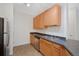 Well-lit kitchen with stainless steel appliances and a double sink, ideal for meal preparation at 2705 S Danube Way # 103, Aurora, CO 80013