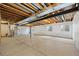 Unfinished basement with open ceiling and concrete floor at 4732 S Coolidge St, Aurora, CO 80016