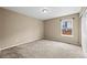 Bedroom with neutral walls, carpet, and window brings in natural light at 4732 S Coolidge St, Aurora, CO 80016