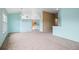 Open-concept living area with blue walls, and seamless access to the kitchen area at 4732 S Coolidge St, Aurora, CO 80016