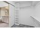 Spacious walk-in closet featuring built-in shelving and rod for organizing clothing and accessories at 4732 S Coolidge St, Aurora, CO 80016