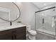 This bathroom has a modern sink, shower and neutral decor at 15137 W 50Th Pl, Golden, CO 80403