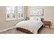 This naturally lit bedroom features a large window and comfortable bed at 15137 W 50Th Pl, Golden, CO 80403