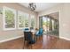 Bright breakfast nook with large windows, a modern light fixture, and sliding glass doors to the outdoor patio at 15137 W 50Th Pl, Golden, CO 80403
