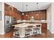Gourmet kitchen with granite countertops, stainless steel appliances, a spacious island, and ample cabinet space at 15137 W 50Th Pl, Golden, CO 80403