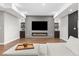 Cozy living room features a modern fireplace, built-in shelving, and neutral tones creating a relaxing atmosphere at 15137 W 50Th Pl, Golden, CO 80403