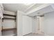 Finished basement with shelves and a closet at 19322 E Eldorado Dr, Aurora, CO 80013