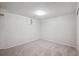 Finished basement with grey carpet and a window at 19322 E Eldorado Dr, Aurora, CO 80013