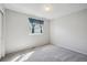 Carpeted bedroom with a light grey paint and natural light from the window at 19322 E Eldorado Dr, Aurora, CO 80013