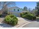 Two story home features lush landscaping, mature trees and a two car garage at 19322 E Eldorado Dr, Aurora, CO 80013