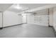 Spacious two-car garage with sealed concrete floors, and modern door at 19322 E Eldorado Dr, Aurora, CO 80013