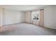 Spacious living room with neutral carpet and window at 19322 E Eldorado Dr, Aurora, CO 80013