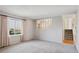Spacious living room with neutral carpet and large window at 19322 E Eldorado Dr, Aurora, CO 80013