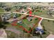 Expansive aerial view of a ranch-style home on a large lot with outbuildings and surrounding landscape in a rural community at 2464 Remington Rd, Elizabeth, CO 80107