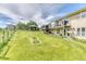 Grassy backyard featuring a pergola with seating area and a second story deck with balconies at 2464 Remington Rd, Elizabeth, CO 80107