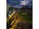 Lovely backyard with a fire pit, deck, and beautiful lighting, ideal for outdoor entertaining at 2464 Remington Rd, Elizabeth, CO 80107