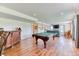 Finished basement featuring a pool table, a bar, and a fireplace, ideal for hosting game nights at 2464 Remington Rd, Elizabeth, CO 80107